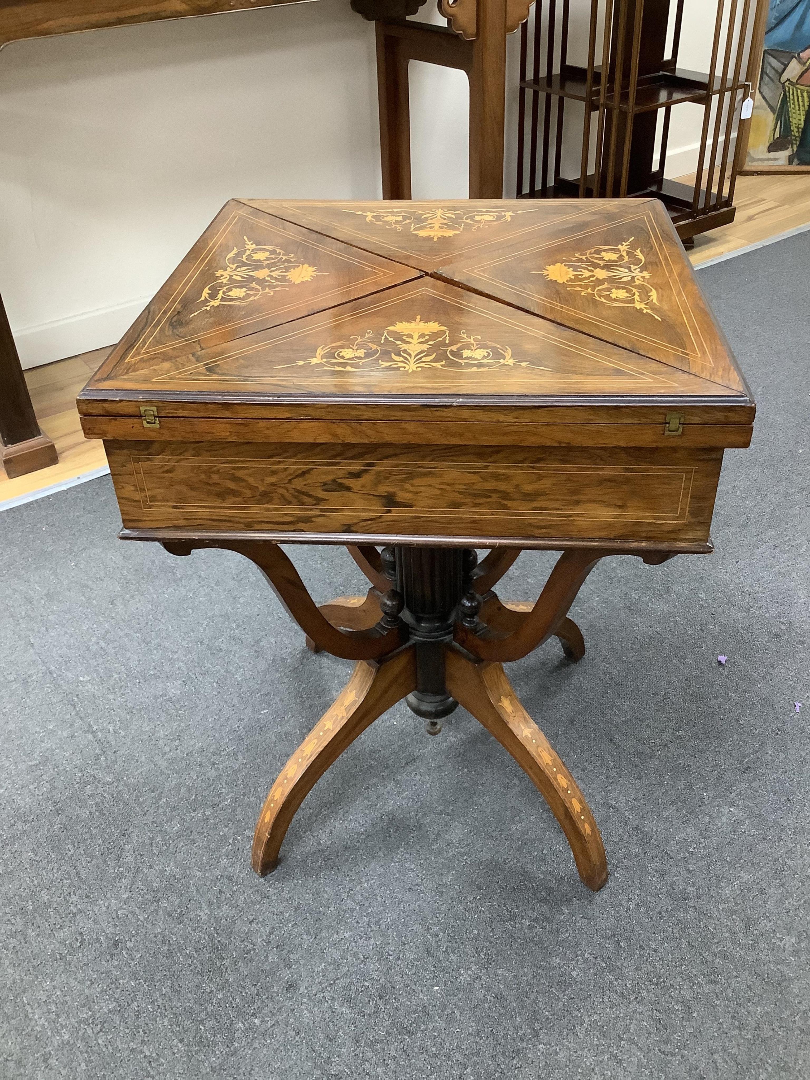 A late Victorian inlaid rosewood envelope card table, width 55cm, depth 55cm, height 71cm. Condition - fair